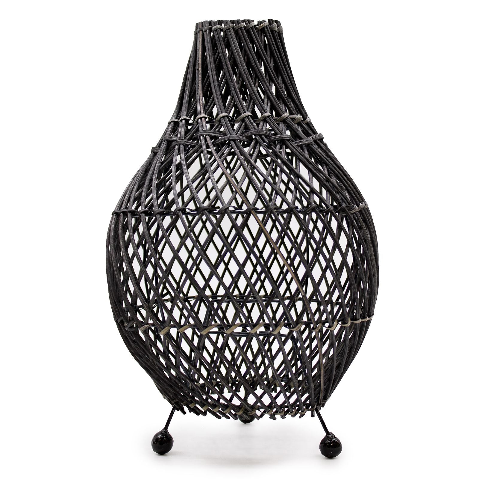 Handcrafted black natural rattan table lamp with intricate woven patterns and a minimalist cylindrical design.