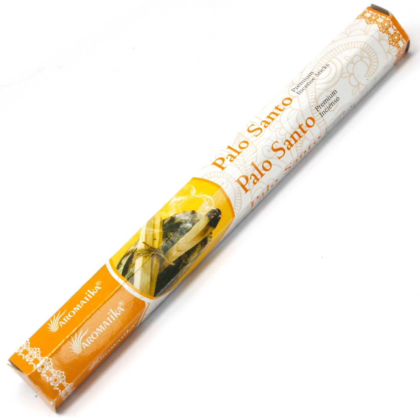 Close-up of hand-rolled masala incense sticks with a natural wooden texture and aromatic coating.
