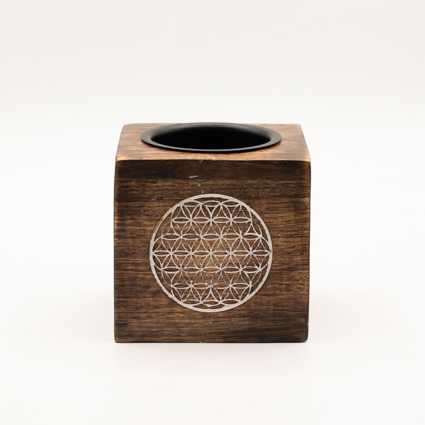Square dark-stained mango wood oil burner with intricate Flower of Life engravings on each side.