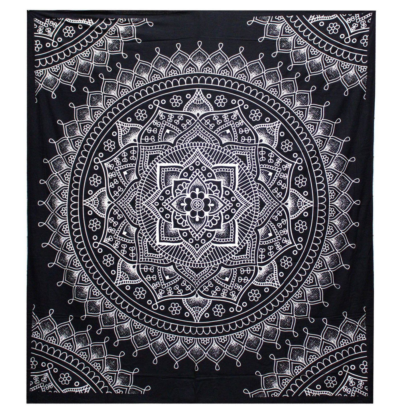 Intricate black and white lotus flower mandala design on a large rectangular cotton bedspread used as a wall hanging.