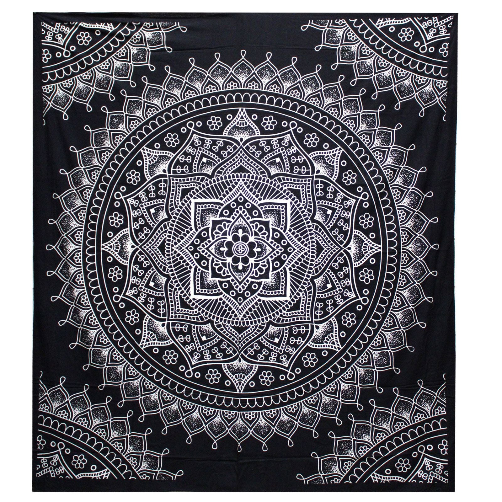 Intricate black and white lotus flower mandala design on a large rectangular cotton bedspread used as a wall hanging.