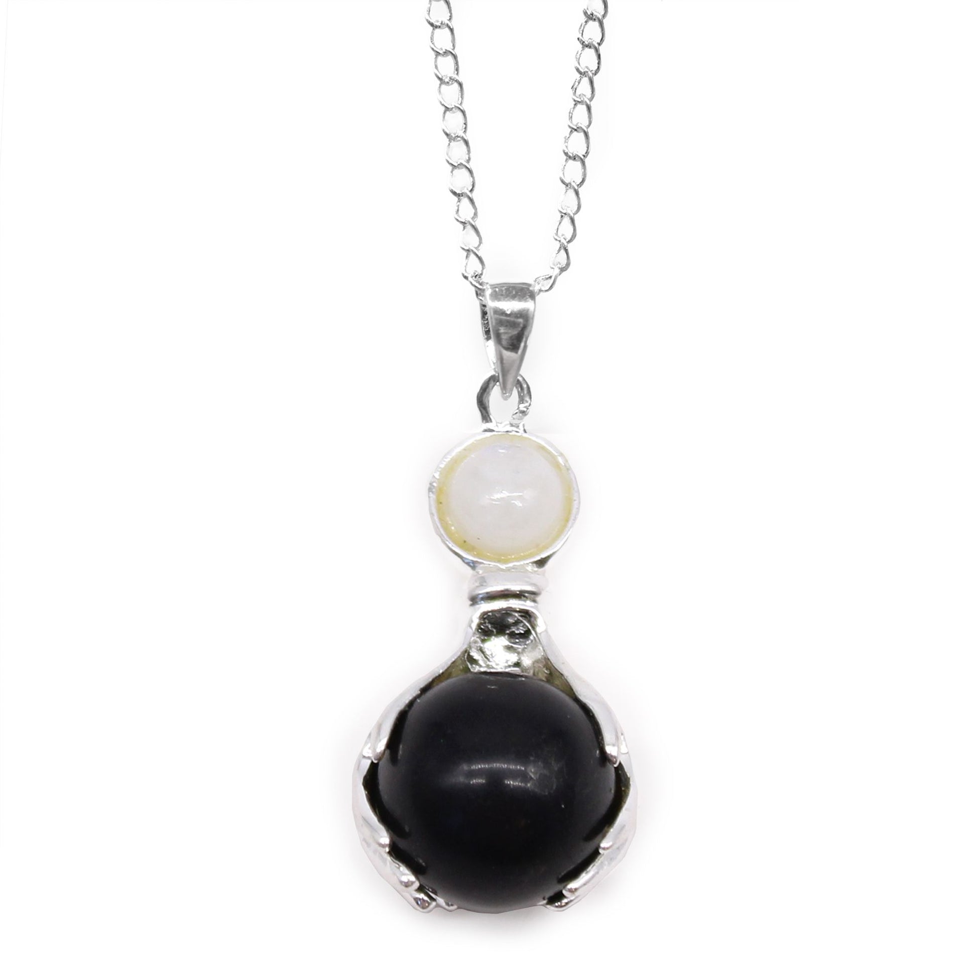 Carved black agate gemstone pendant in the shape of healing hands with a silver-tone bale.