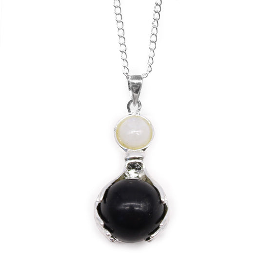 Carved black agate gemstone pendant in the shape of healing hands with a silver-tone bale.