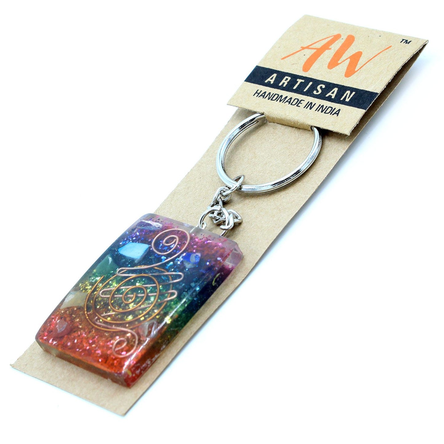 Circular orgonite keyring featuring copper shavings and multi-coloured chakra stones set in clear resin.