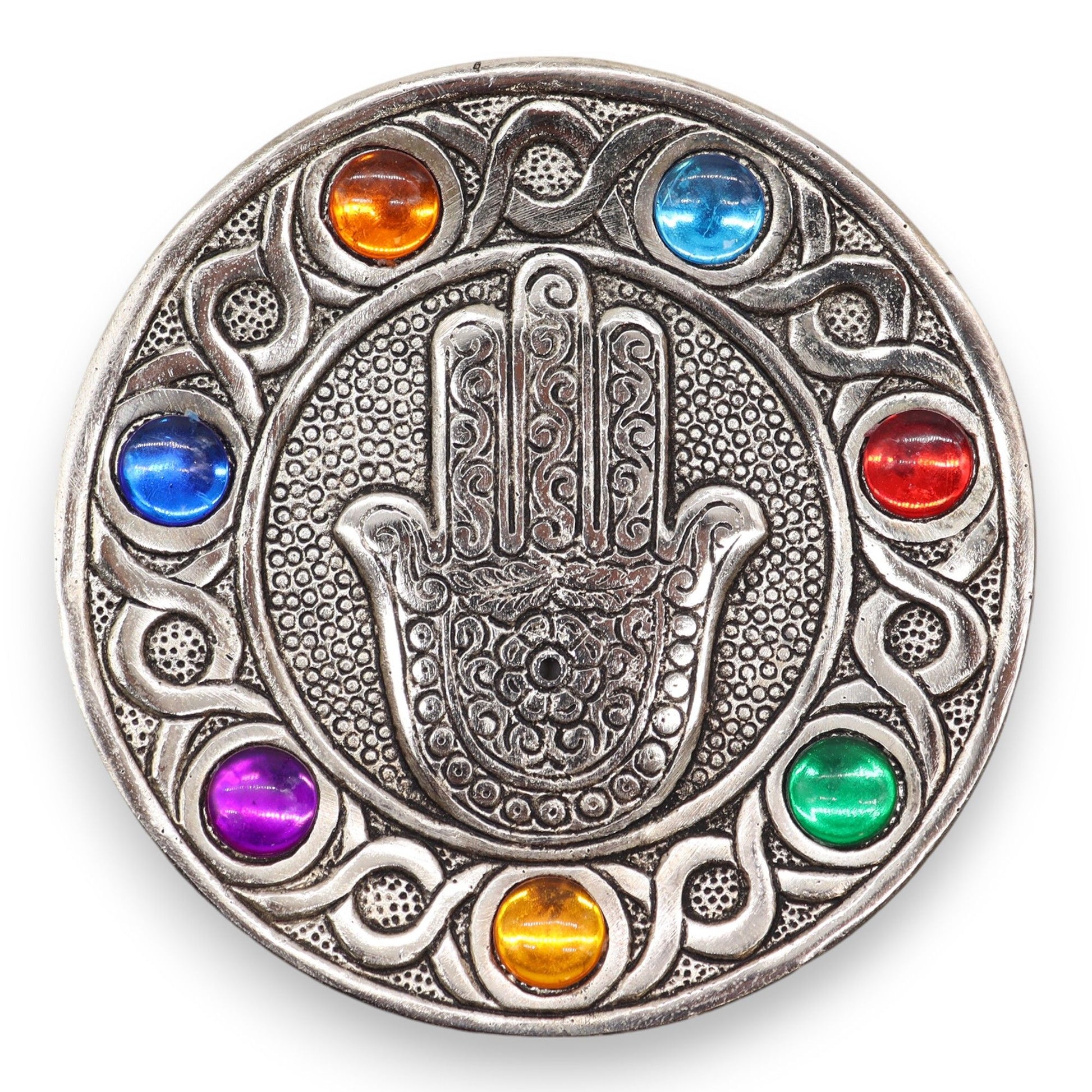 Handcrafted silver-coloured aluminium Hamsa hand incense holder decorated with seven colourful chakra stones.
