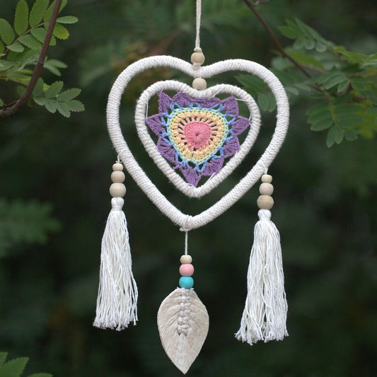 Handmade medium-sized natural dream catcher featuring multiple heart-in-heart woven webs and decorative hanging tails.