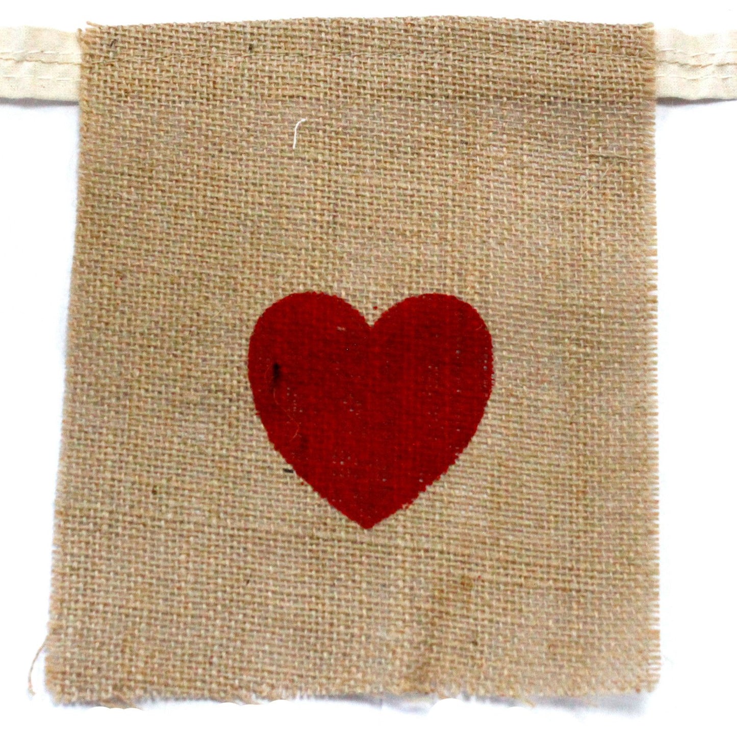 Large natural jute bunting spelling out I Love You with red hearts on rectangular flags against a plain background.