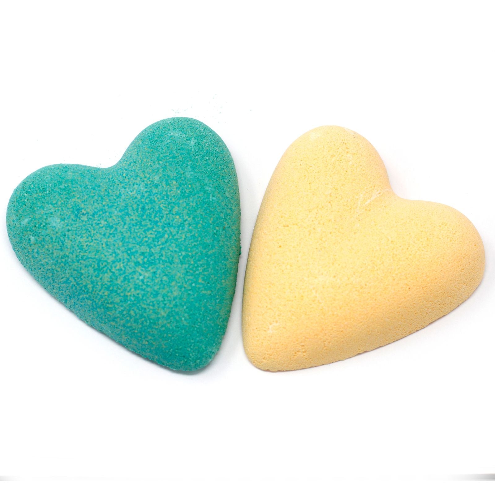 Heart-shaped festive bath fizzers with a vibrant design, perfect for a relaxing holiday bath ritual.