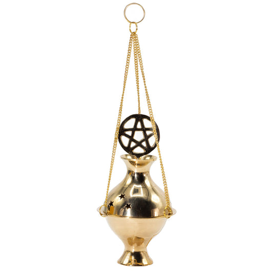 Round brass hanging incense burner with a cut-out pentagram design suspended on three golden chains.