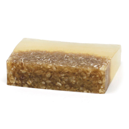 Handcrafted rectangular soap bar with visible textured oatmeal grains and a rich golden honey hue.