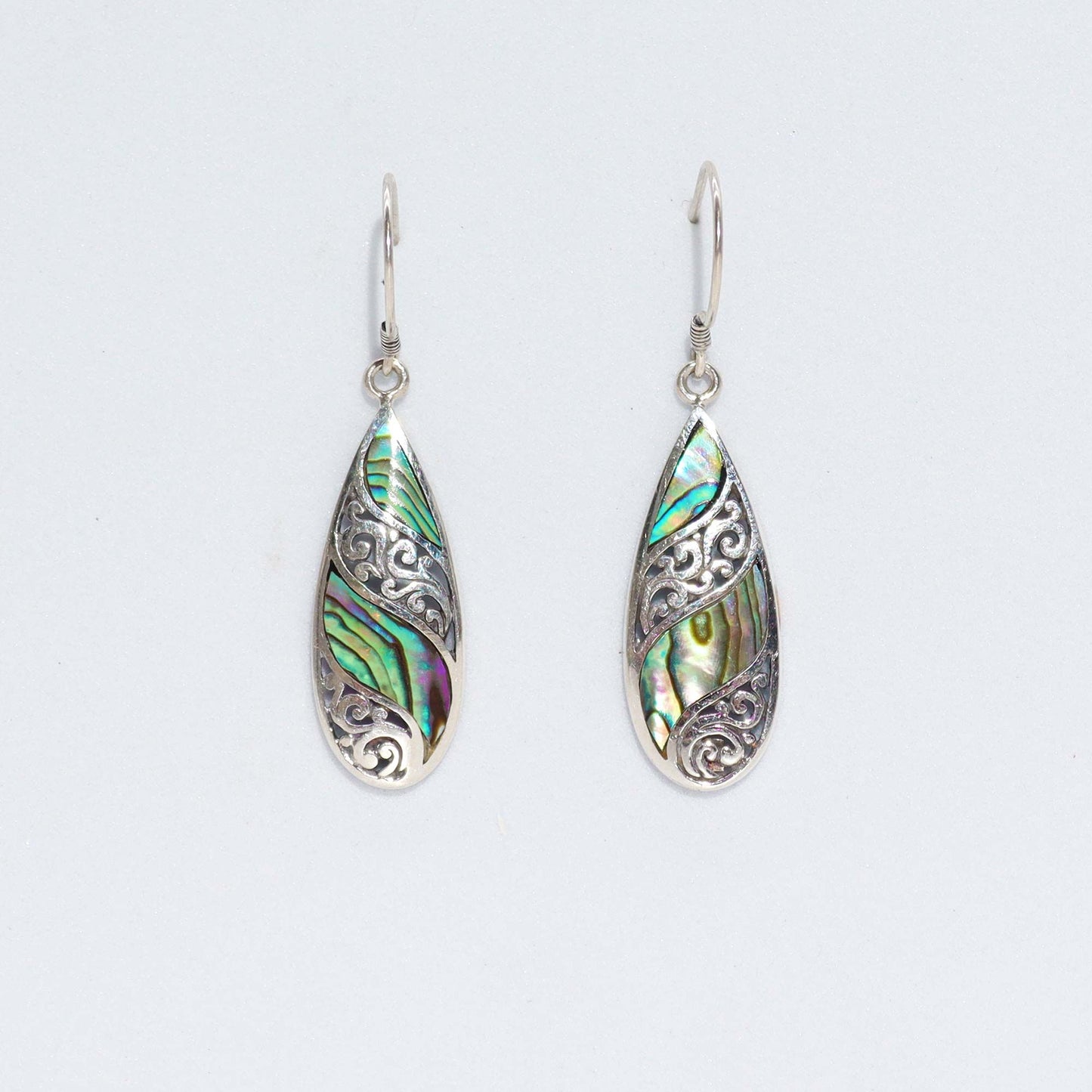 Elegant long teardrop earrings featuring iridescent abalone shell set in polished sterling silver.