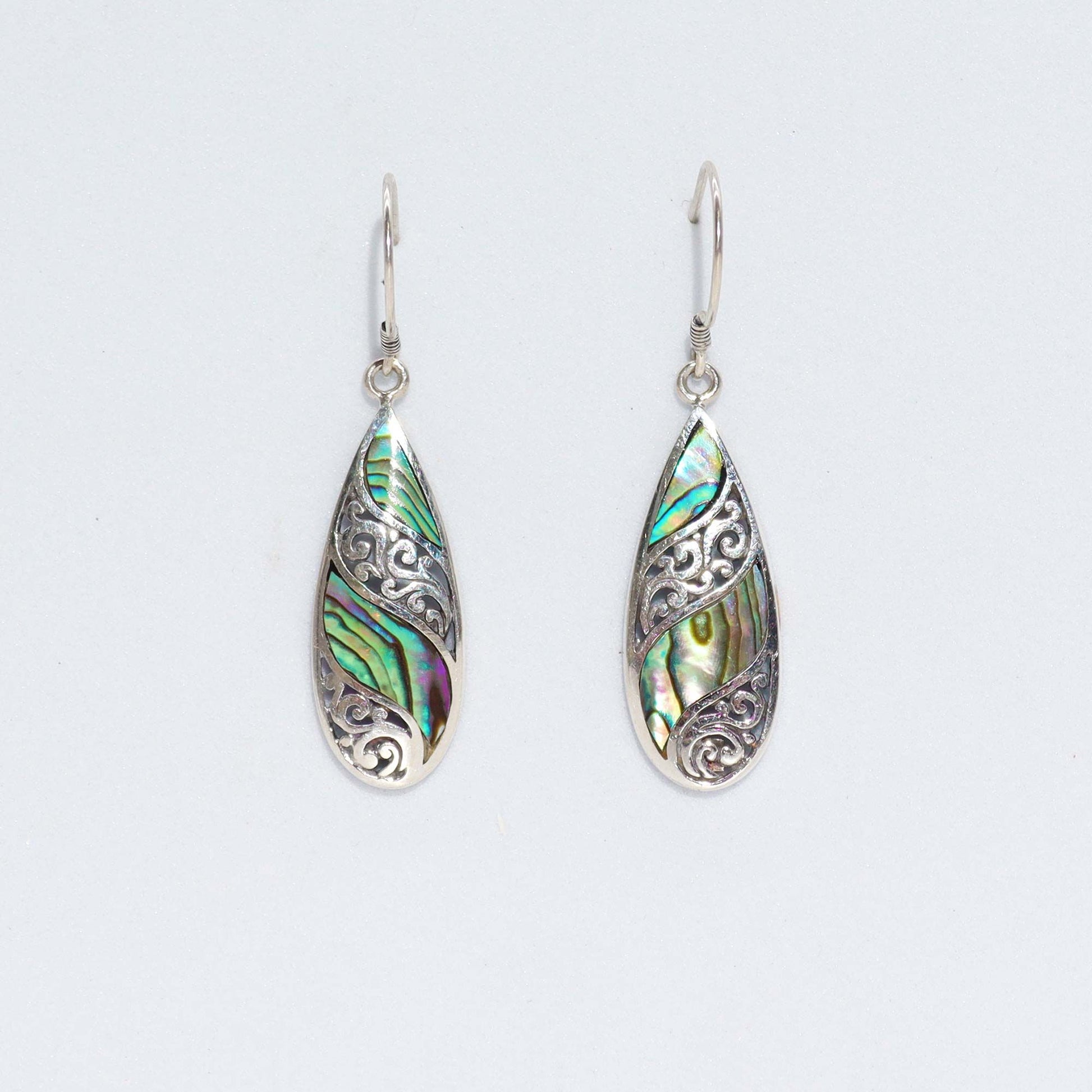 Elegant long teardrop earrings featuring iridescent abalone shell set in polished sterling silver.