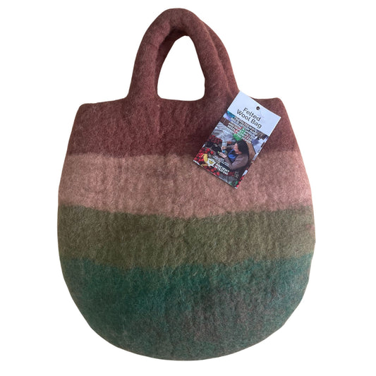 Handcrafted wool felted bag featuring a colourful whimsical mushroom garden design with vibrant toadstools and green foliage.