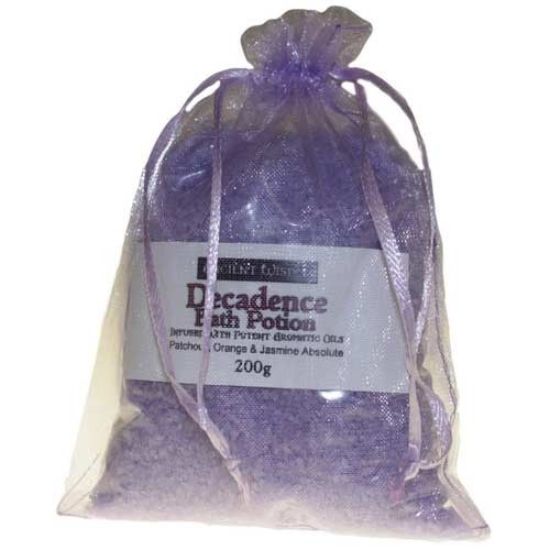 Close-up of aromatic purple bath salts mixed with essential oils in a simple clear bag.