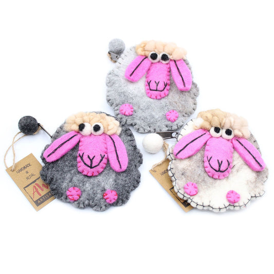 Handmade natural felt zipper pouch featuring a cute white sheep design on a neutral background.