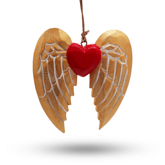 Hand-painted gold wooden angel wing and heart Christmas decorations with white detail hanging from a rustic string.
