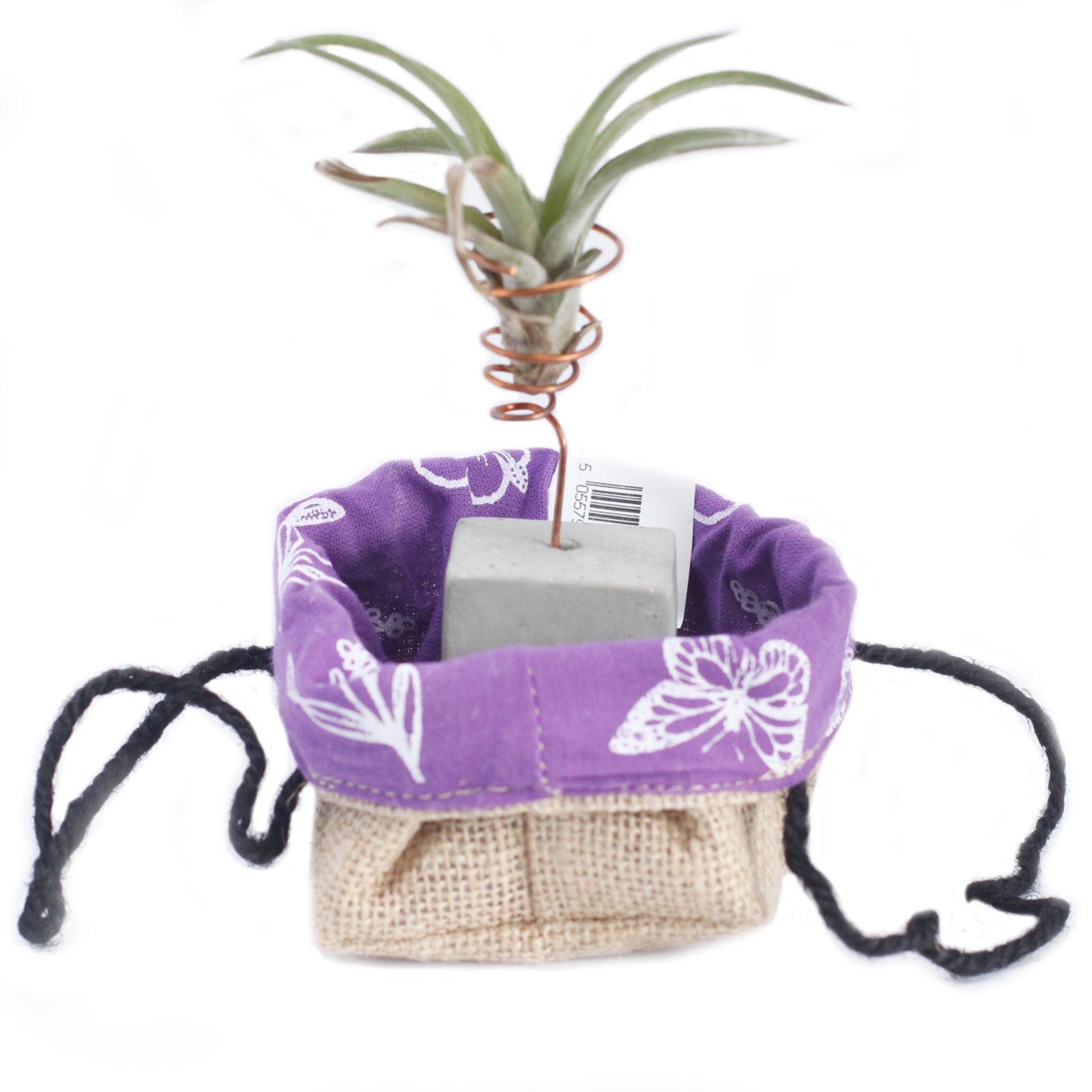 Small natural jute gift bag with a visible lavender purple cotton lining and sturdy woven handles.