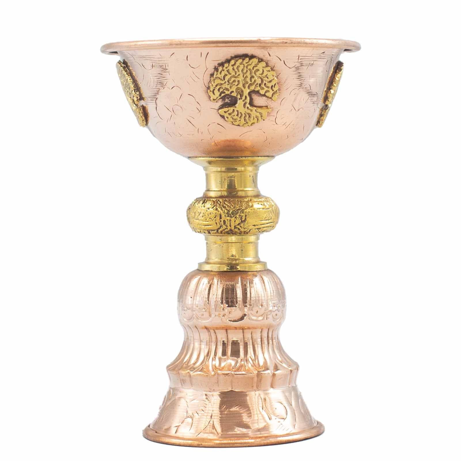 Polished copper ritual goblet with an embossed Tree of Life design on a sturdy pedestal base.