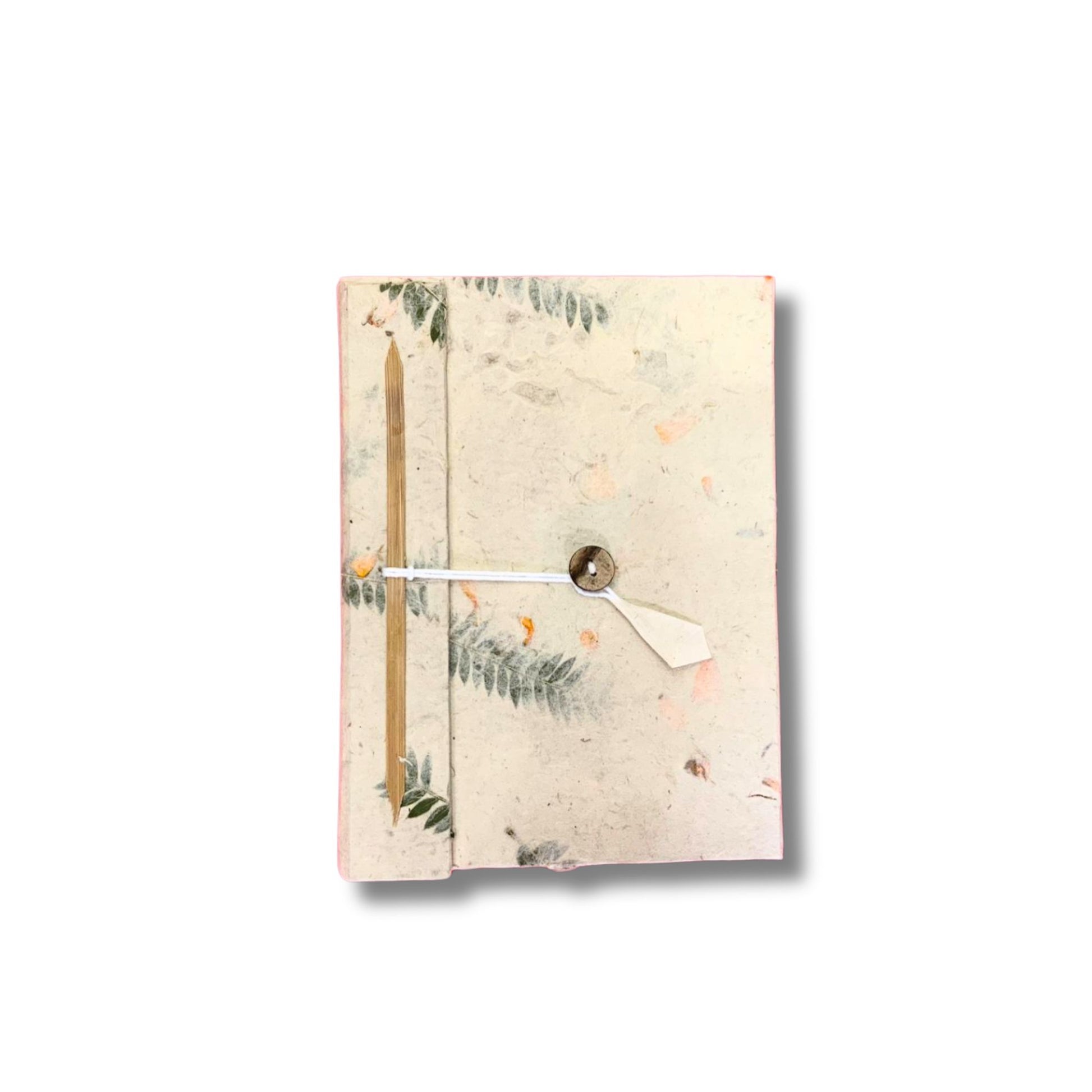 Handmade Lokta paper notebook with real dried flowers pressed into the cover and a natural textured finish.