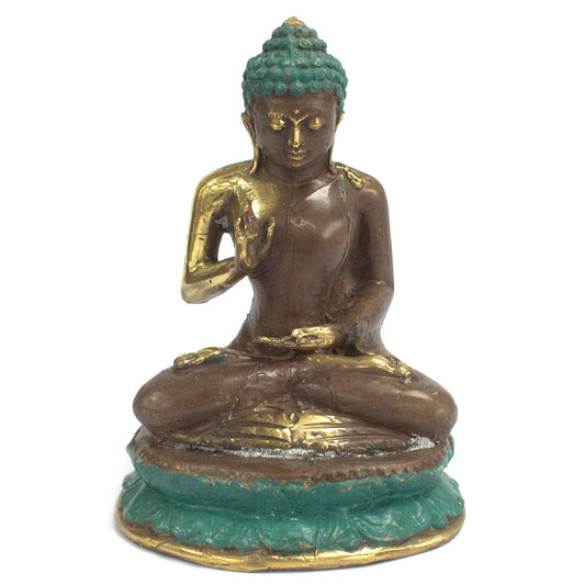 Intricately detailed large brass statue of a sitting Buddha in a meditative pose with a serene expression.