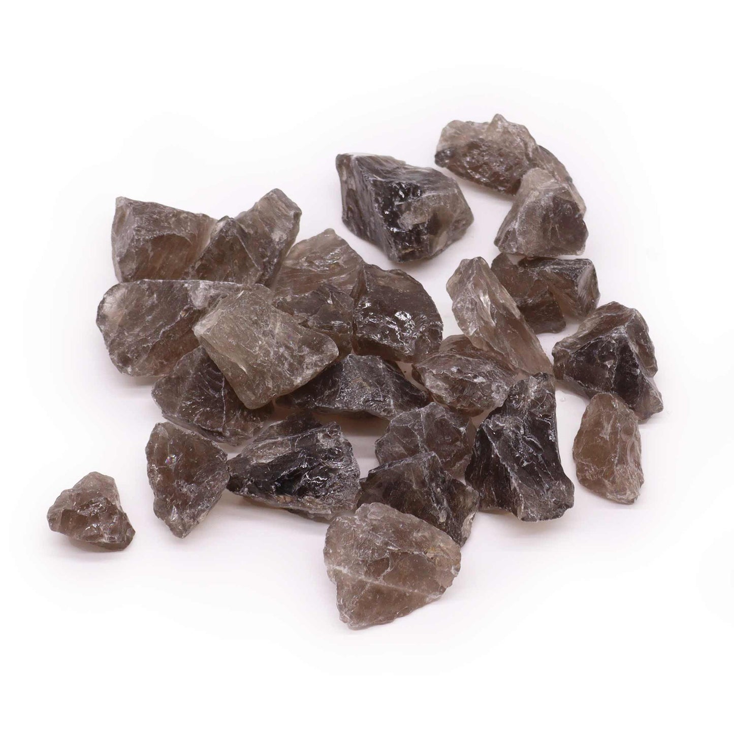 A collection of natural raw smoky quartz crystals with translucent brown and grey tones on a plain background.
