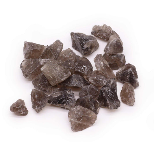 A collection of natural raw smoky quartz crystals with translucent brown and grey tones on a plain background.