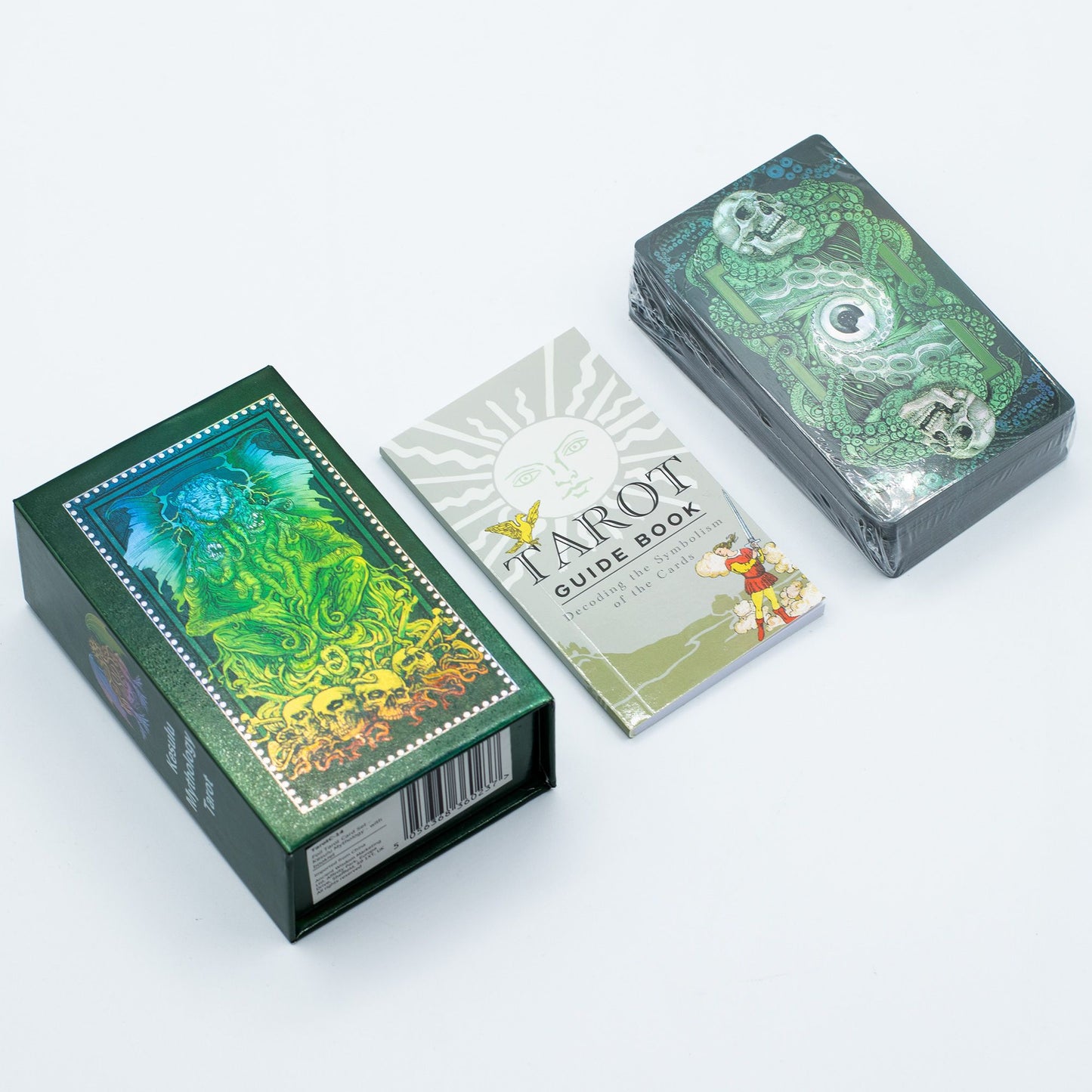 Deep green tarot cards with intricate gold foil mythological illustrations and a matching guidebook in a gift box.