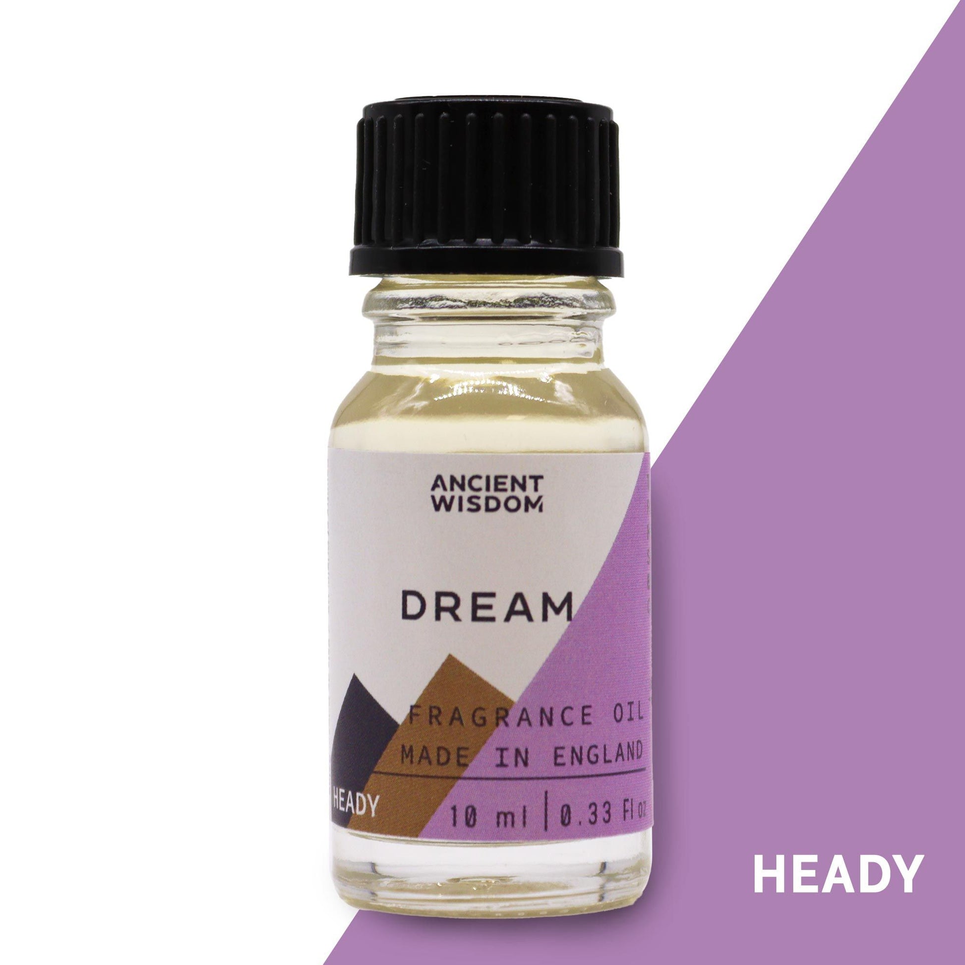 Small amber glass bottle of fragrance oil with a white label on a neutral background.