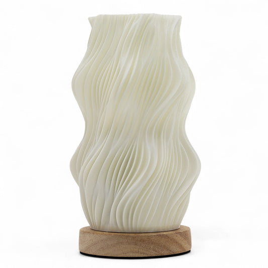 Modern twisted sculptural lamp with a star-inspired silhouette and warm ambient lighting.