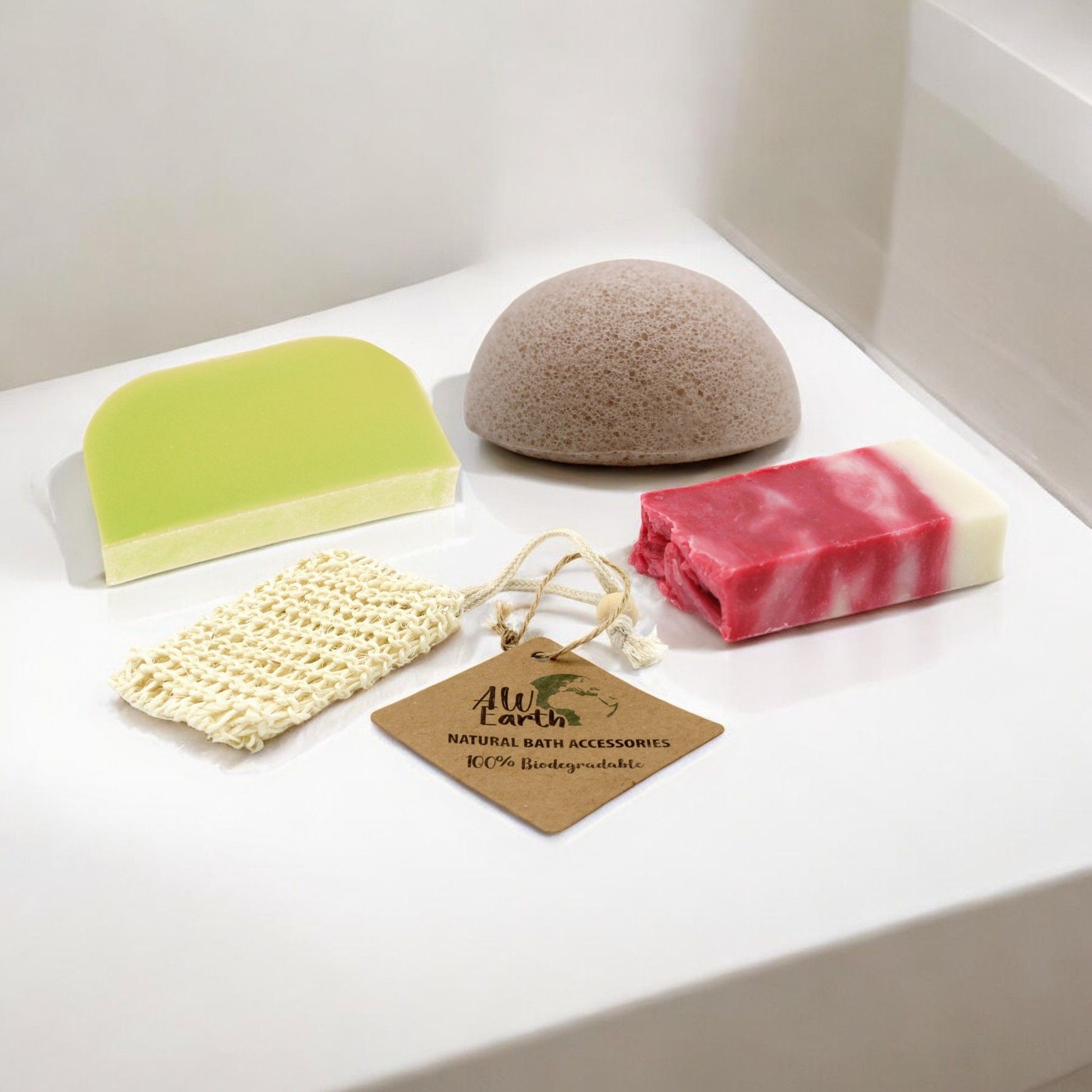 Eco-friendly bathroom gift set featuring a slice of rosehip soap, a solid shampoo bar, and a natural konjac sponge.