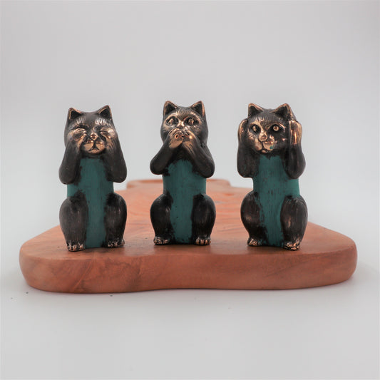 Set of three small polished brass cat figurines representing the See No, Hear No, and Speak No Evil proverbs.