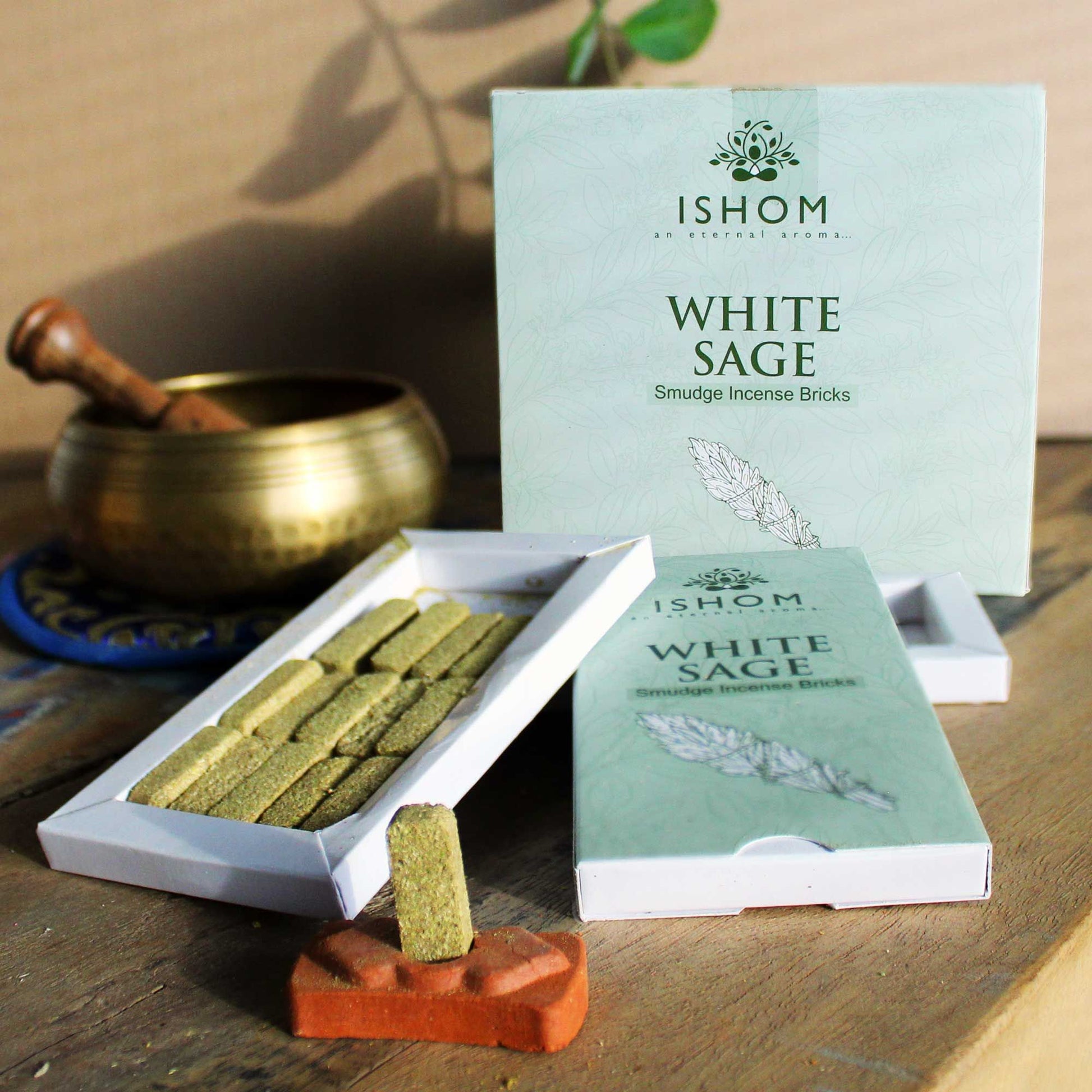 Pack of 15 natural white sage incense smudge bricks alongside a small round terracotta burner bowl.