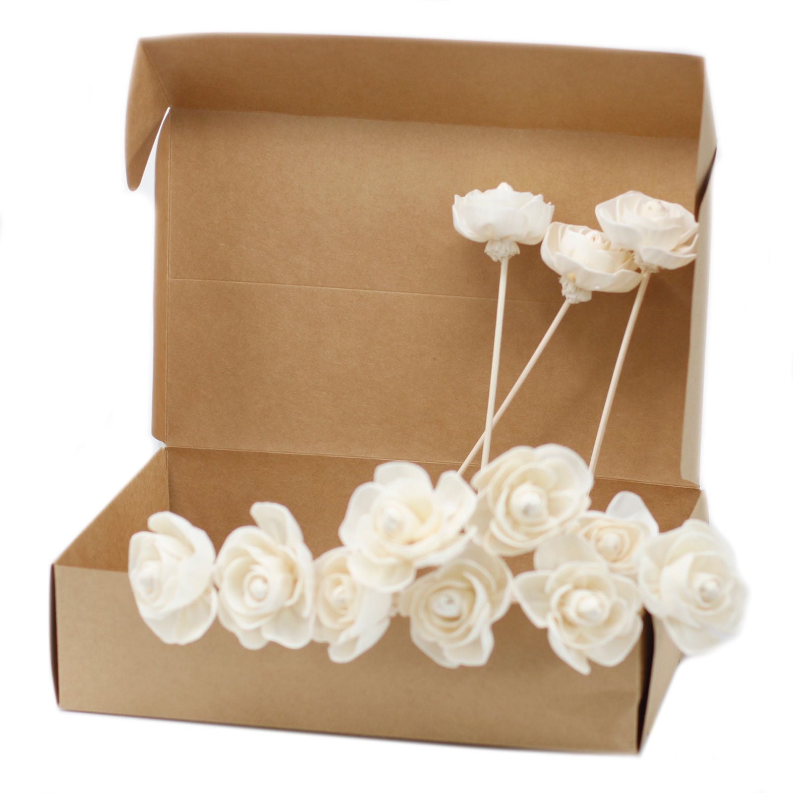 Handcrafted white sola wood rose flower attached to a natural reed stick for aromatherapy diffusers.
