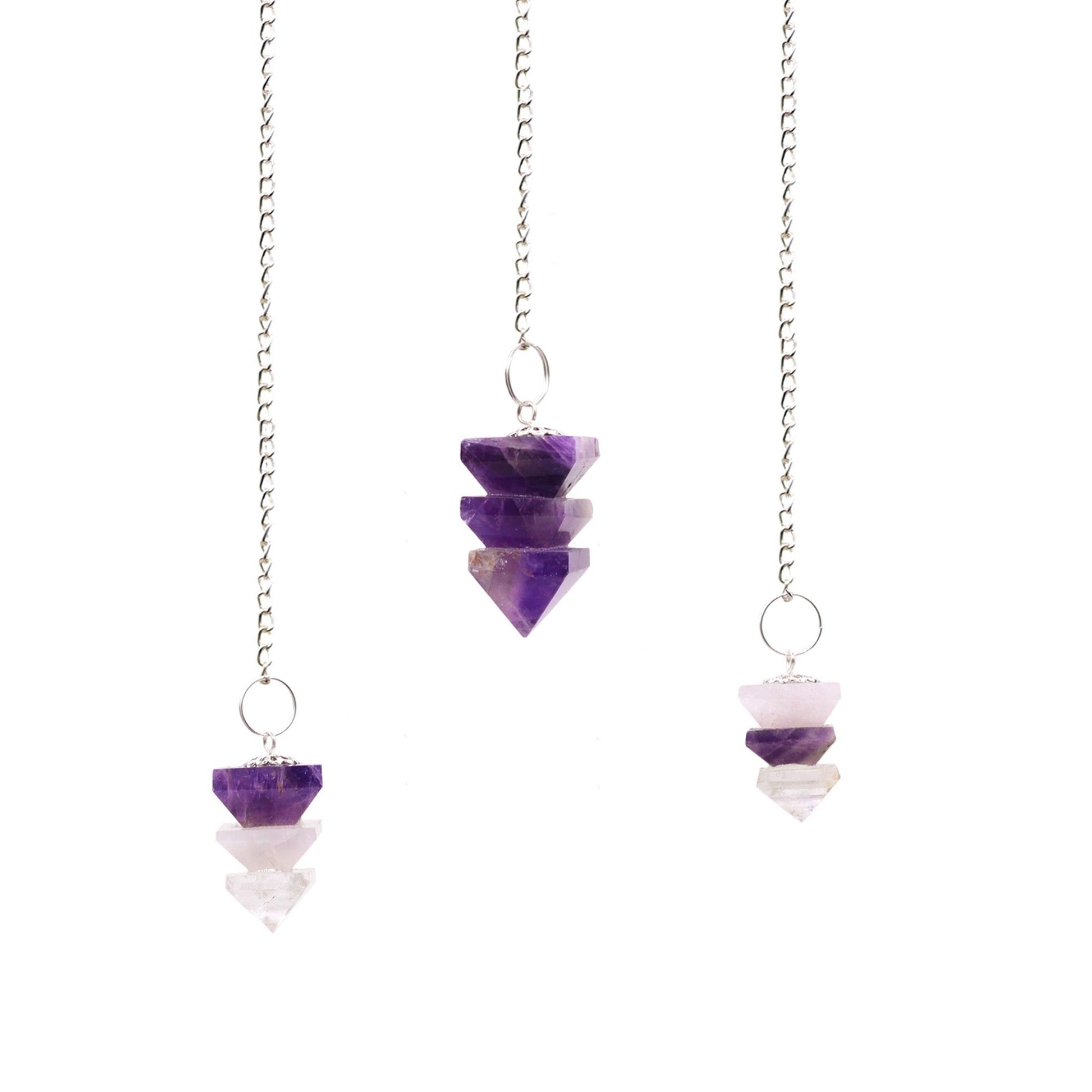 A pointed pyramid-shaped crystal pendulum attached to a delicate silver chain with a small gemstone bead at the top.