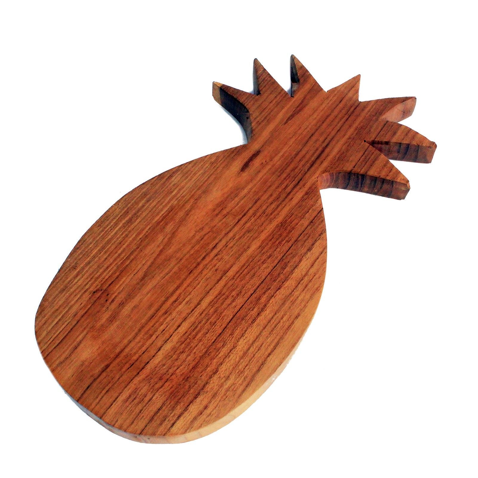 Hand-carved teak wood chopping board in a decorative pineapple shape with natural wood grain.