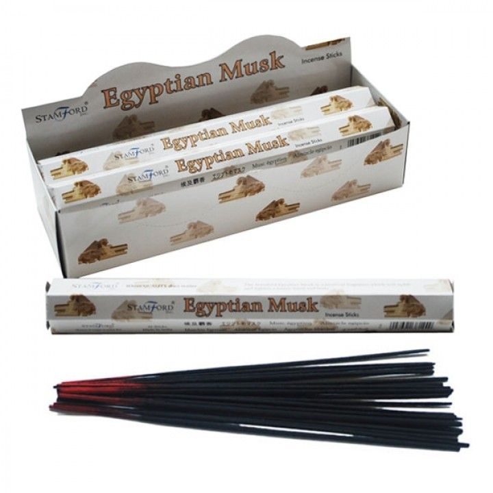 Hexagonal box and individual sticks of premium Egyptian Musk incense on a neutral background.