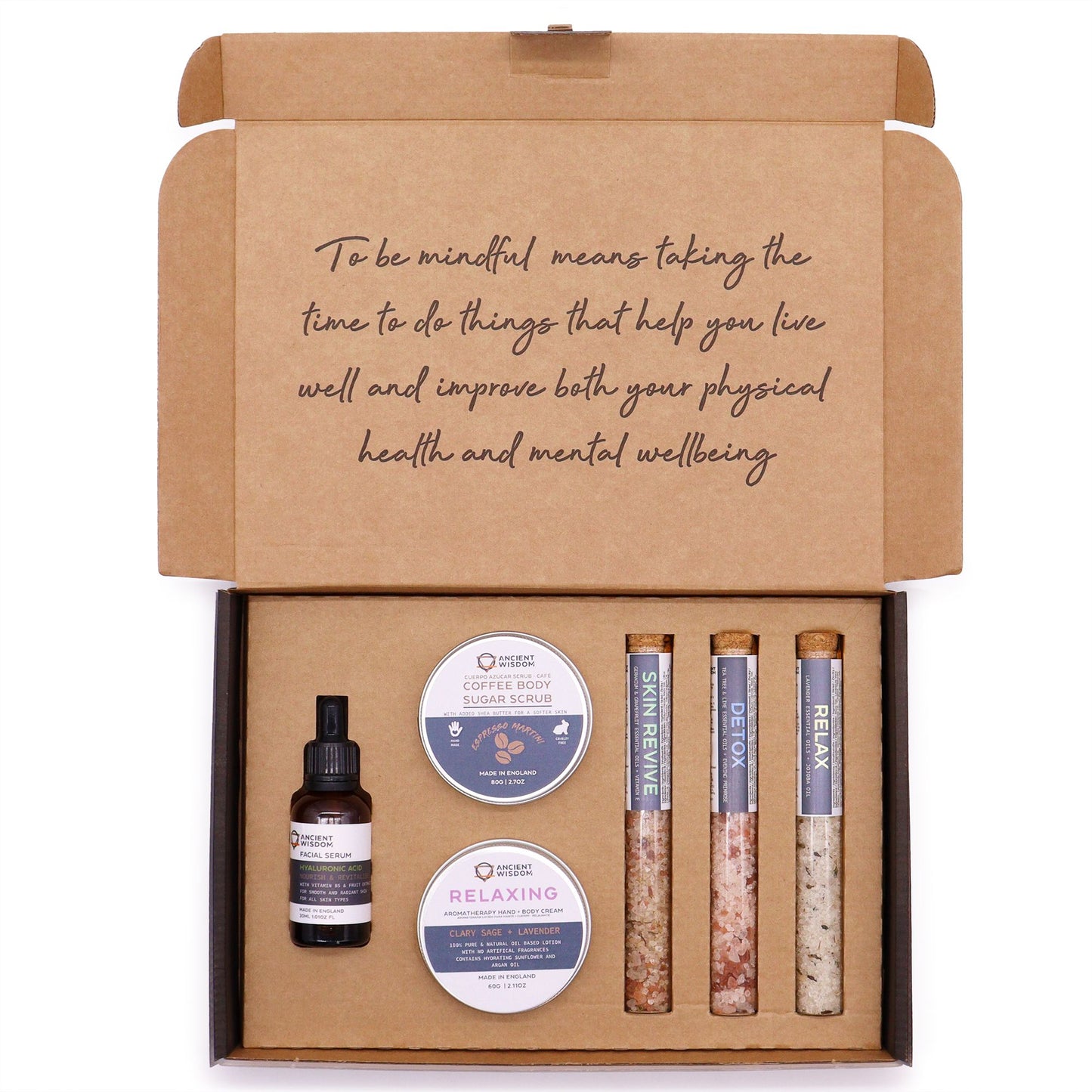 Luxury self-care gift set featuring a jar of coffee sugar body scrub and a tin of relaxing body cream.