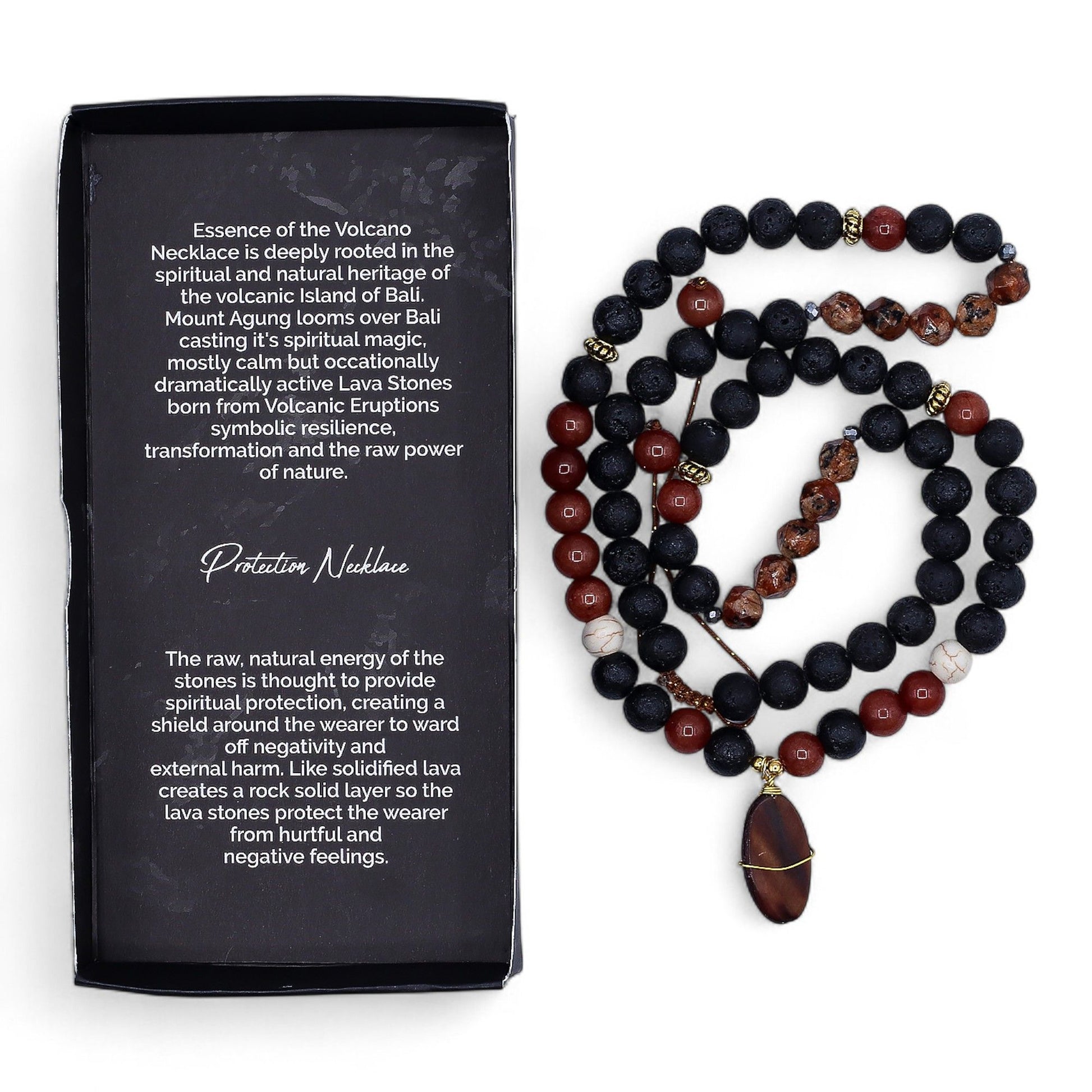 Close-up of a spiritual protection necklace featuring dark, porous black lava stone beads on a simple cord.