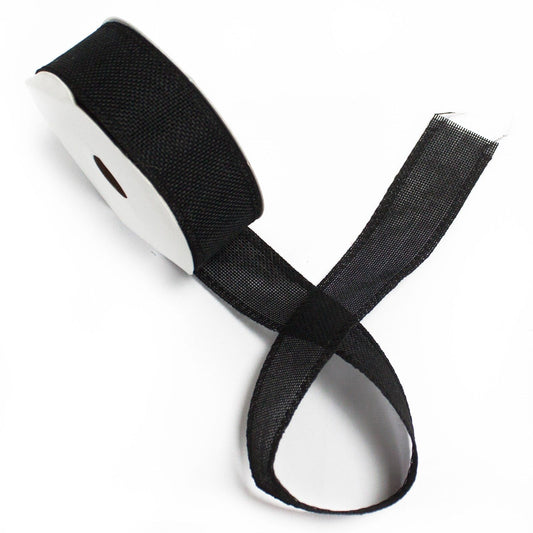 Roll of wide black natural texture ribbon with a unique non-woven fabric finish for gift wrapping and crafts.