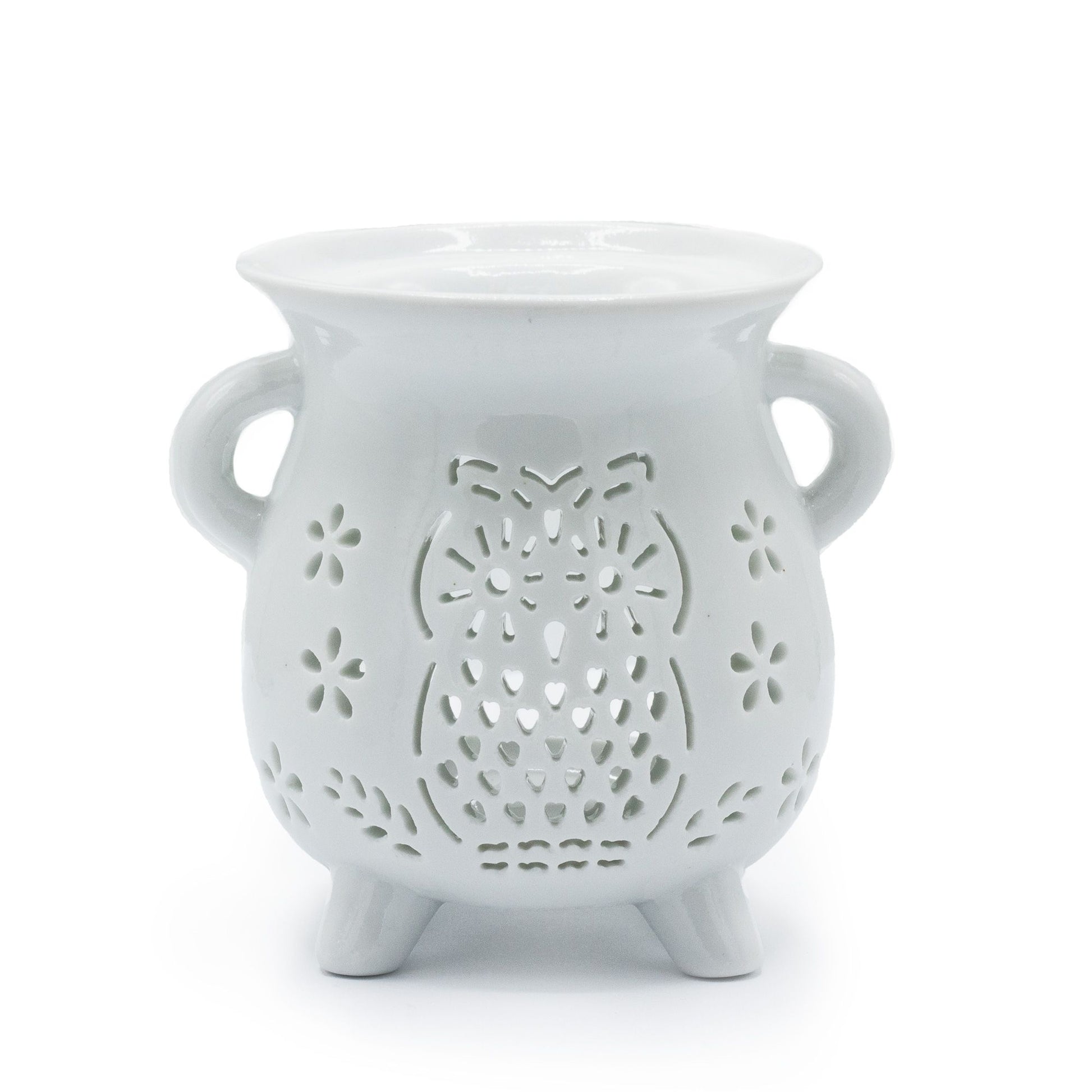 Minimalist white ceramic oil burner shaped like an owl with decorative cut-outs for candlelight to shine through.