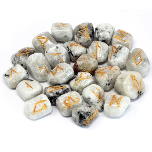 A set of iridescent Rainbow Moonstone rune stones with engraved symbols and a protective drawstring pouch.