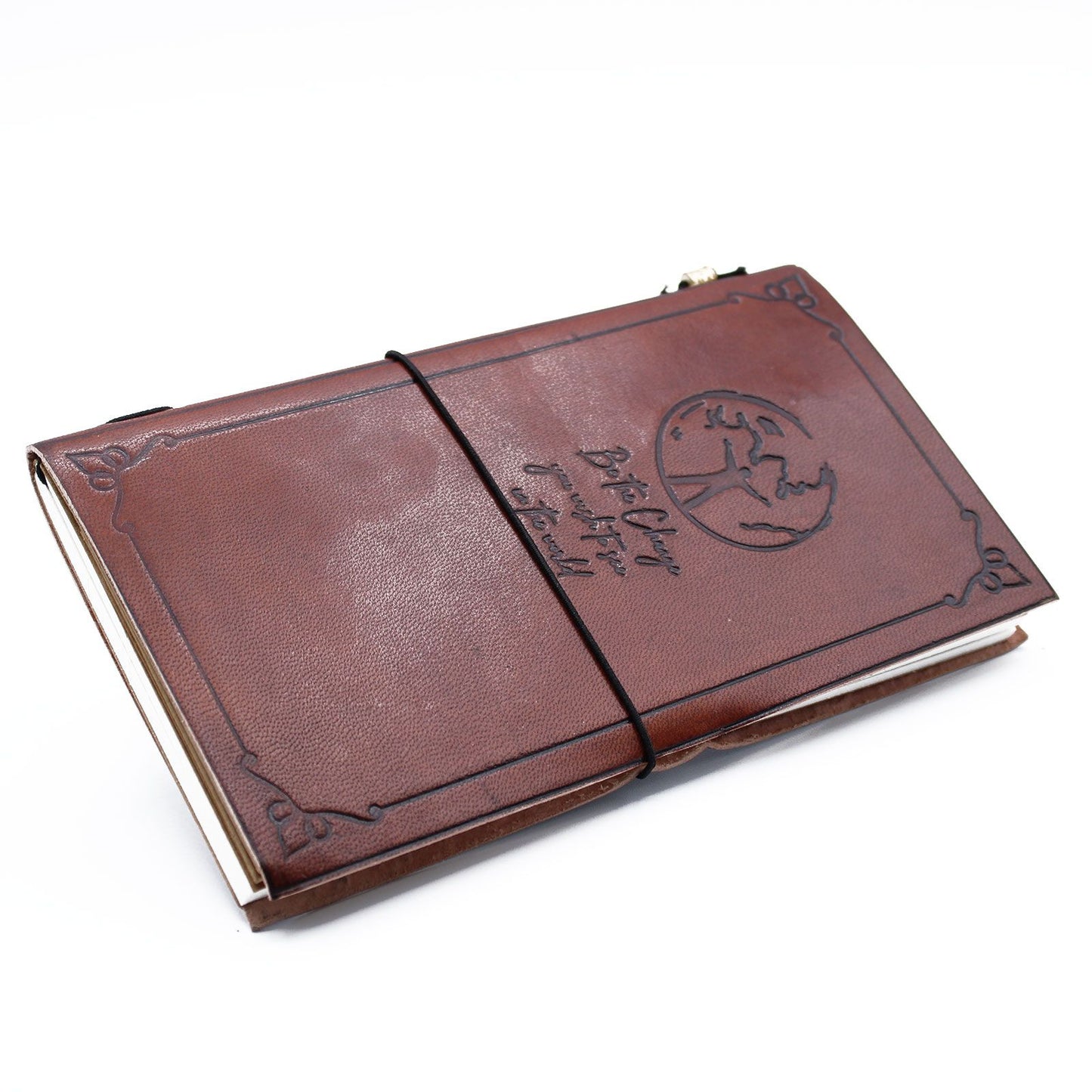 Slim brown handmade leather journal with an embossed Be the Change quote design and a wrap-around leather tie closure.