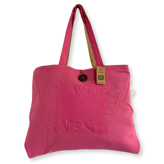 Large reversible pink tote bag made from woven jute and soft cotton with sturdy handles.