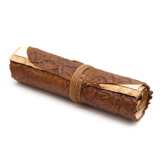 Handcrafted natural brown rolled leather travel notebook with a vintage tie closure and textured finish.