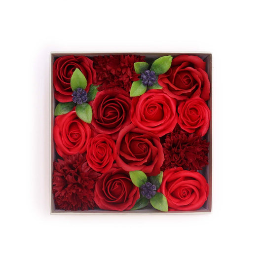 Realistic red rose soap flowers arranged beautifully inside a minimalist black square gift box.