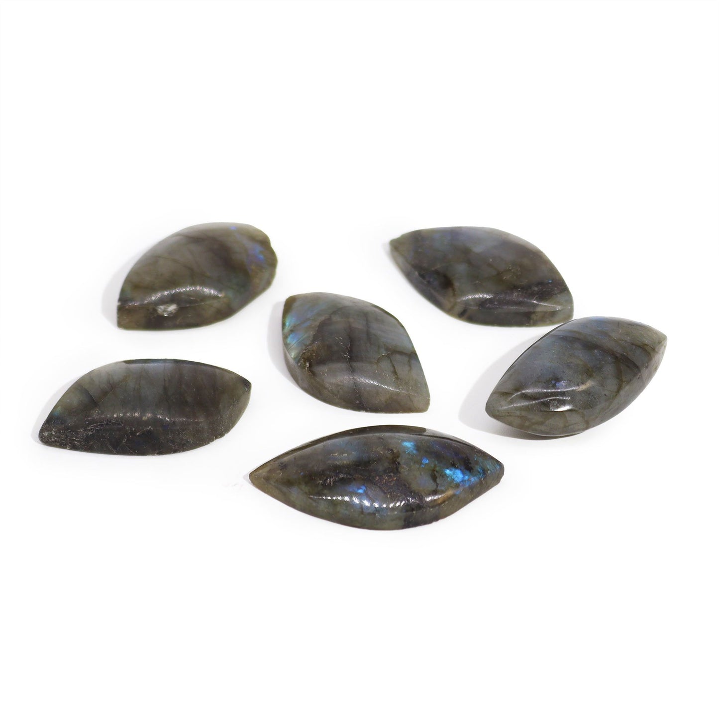 Hand-carved Labradorite gemstone in the shape of a leaf showing iridescent blue and green flashes.