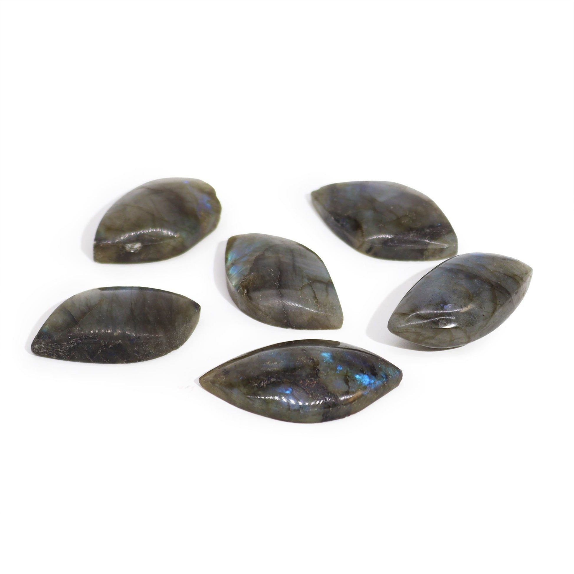 Hand-carved Labradorite gemstone in the shape of a leaf showing iridescent blue and green flashes.
