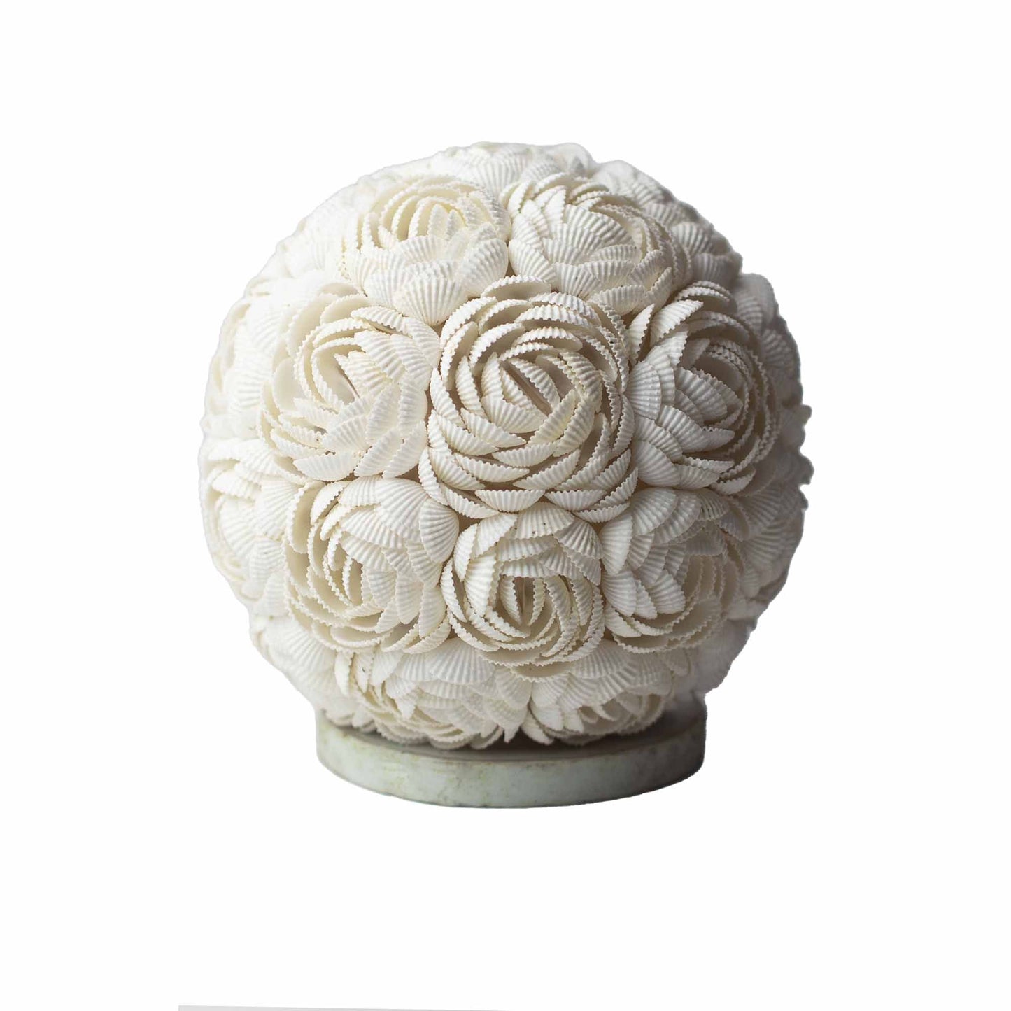 Handcrafted rose globe lamp meticulously covered in real cream-coloured seashells for a coastal boho aesthetic.