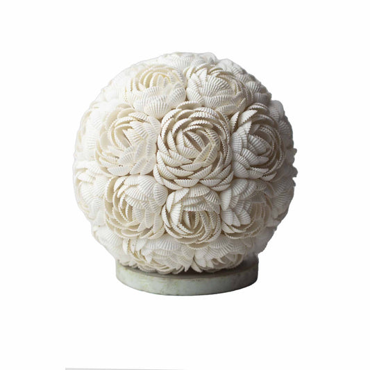 Handcrafted rose globe lamp meticulously covered in real cream-coloured seashells for a coastal boho aesthetic.