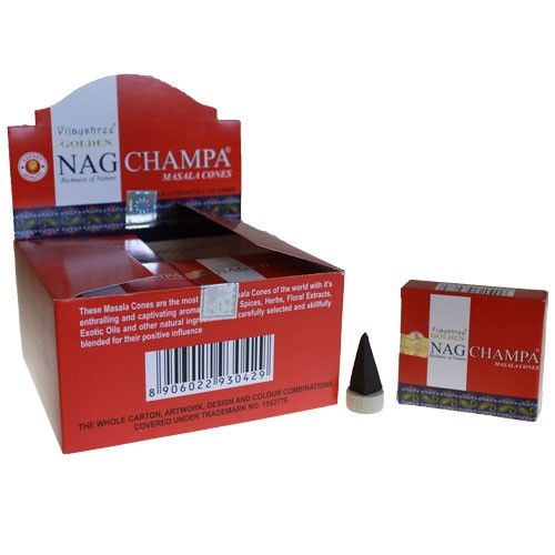 Golden Nag Champa incense cones displayed on a decorative burner, releasing a gentle trail of aromatic smoke.